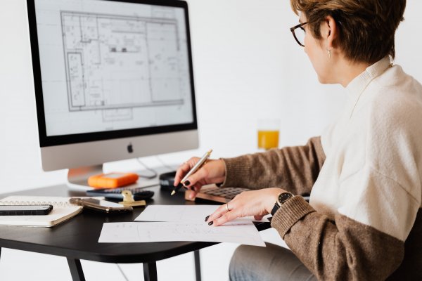 Woman designing blueprint